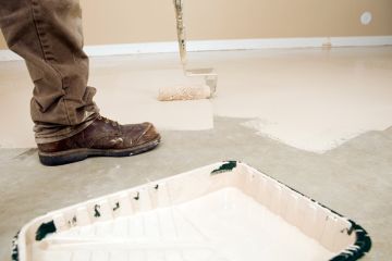 Painter painting garage floor in Withamsville